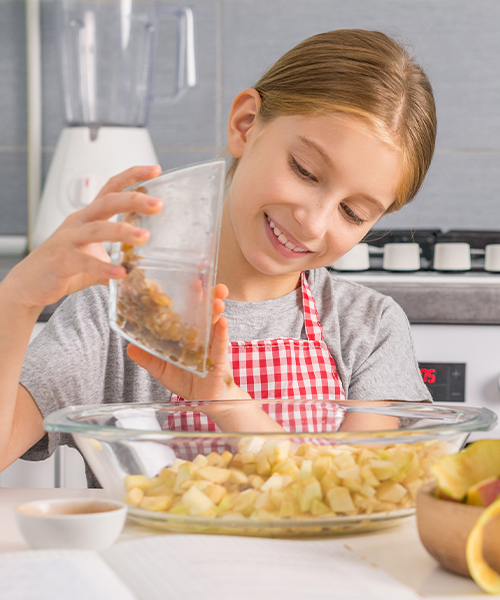 girl preparing food in kitchen